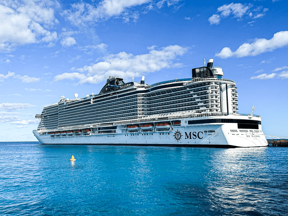 MSC Seashore Cruise Deals. Luxury cruise surrounded by blue water.