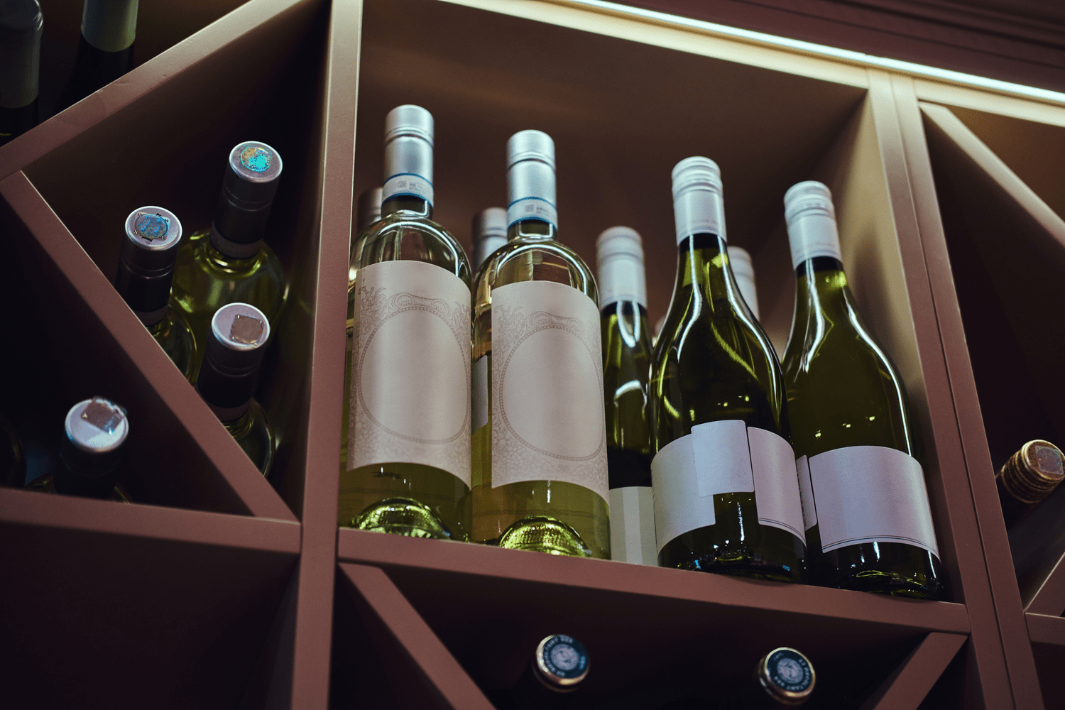 Bottles of wine on a shelf.