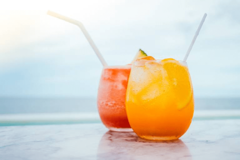 Two cocktails on the beach.
