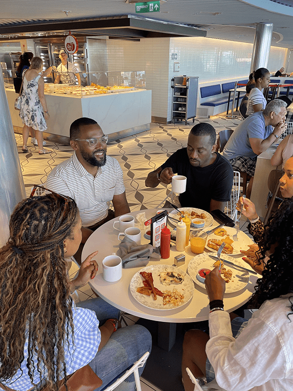 People enjoying food on the Virgin Voyages cruise.
