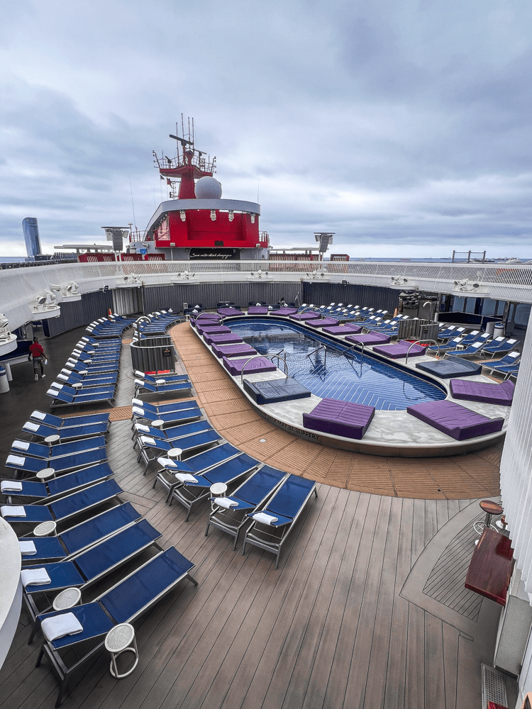 The pool of the Virgin Voyages Scarlet Lady.