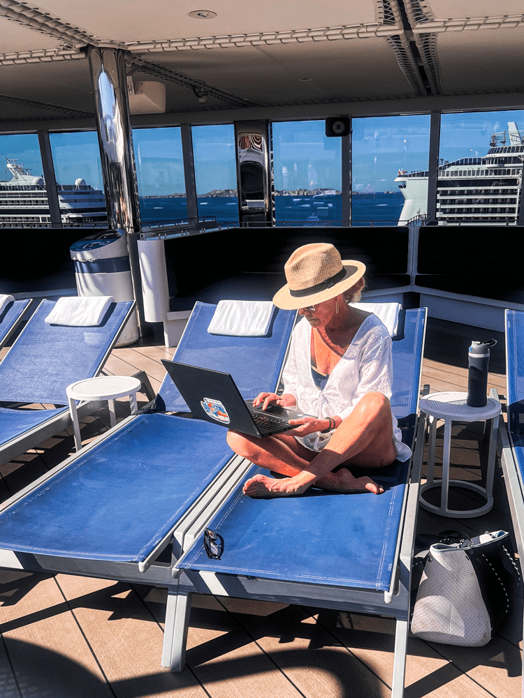 Jenny Lynn working on her laptop on the cruise.