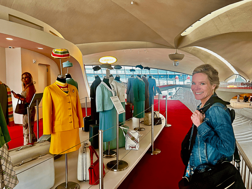 Jenny Lynn Anderson at the Flight Attendant Clothing Exhibit at TWA Hotel.