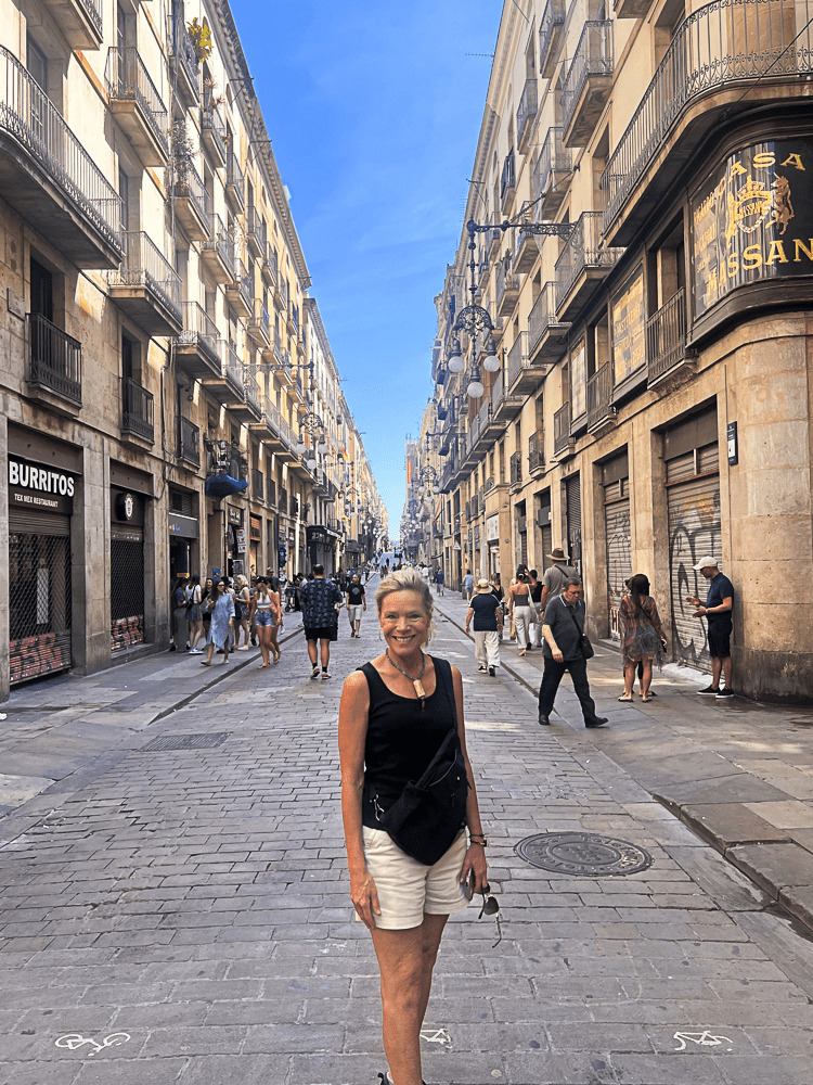 Jenny Lynn Anderson standing in a street with houses in the background.