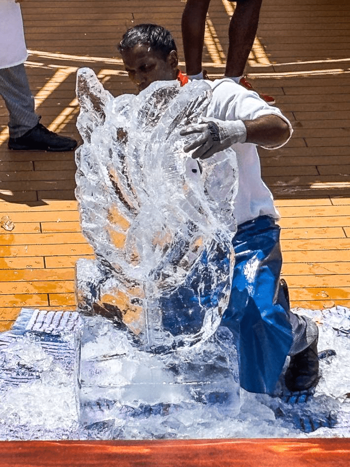 A man carving ice on a cruise.