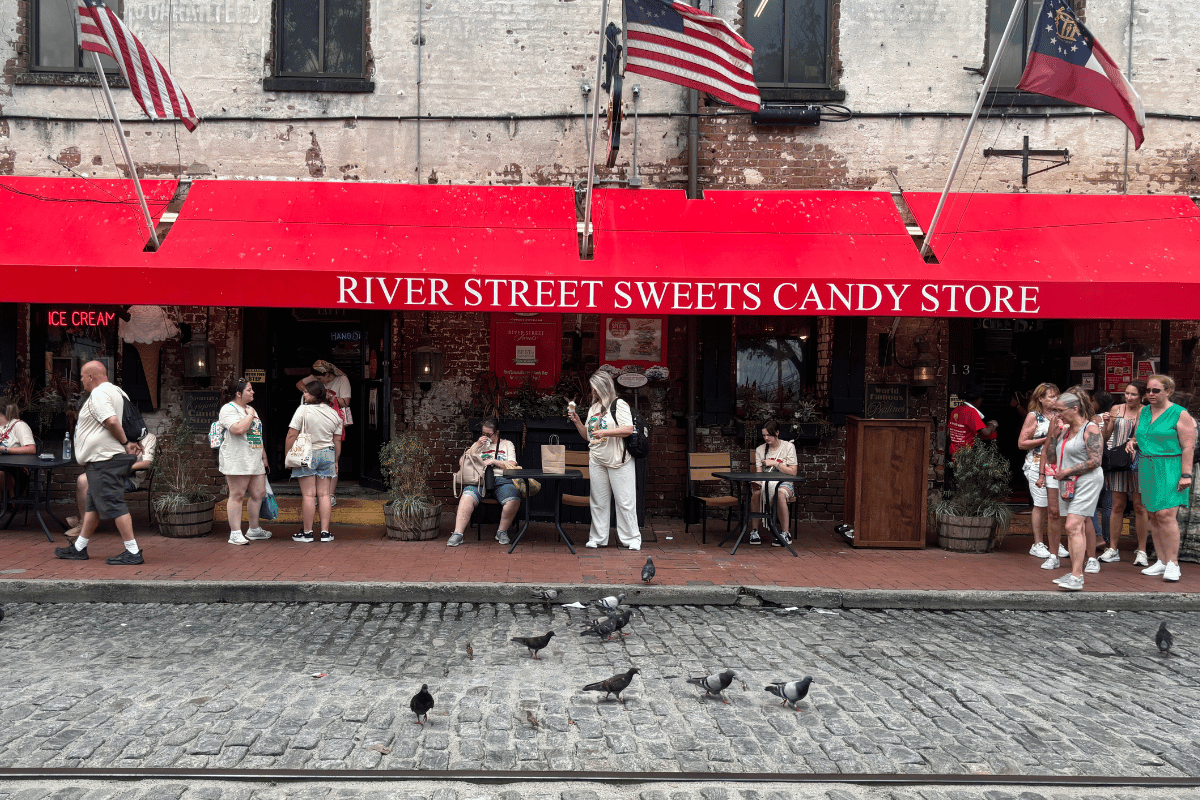 Cobblestone streets in front of River Street Sweets candy store. 