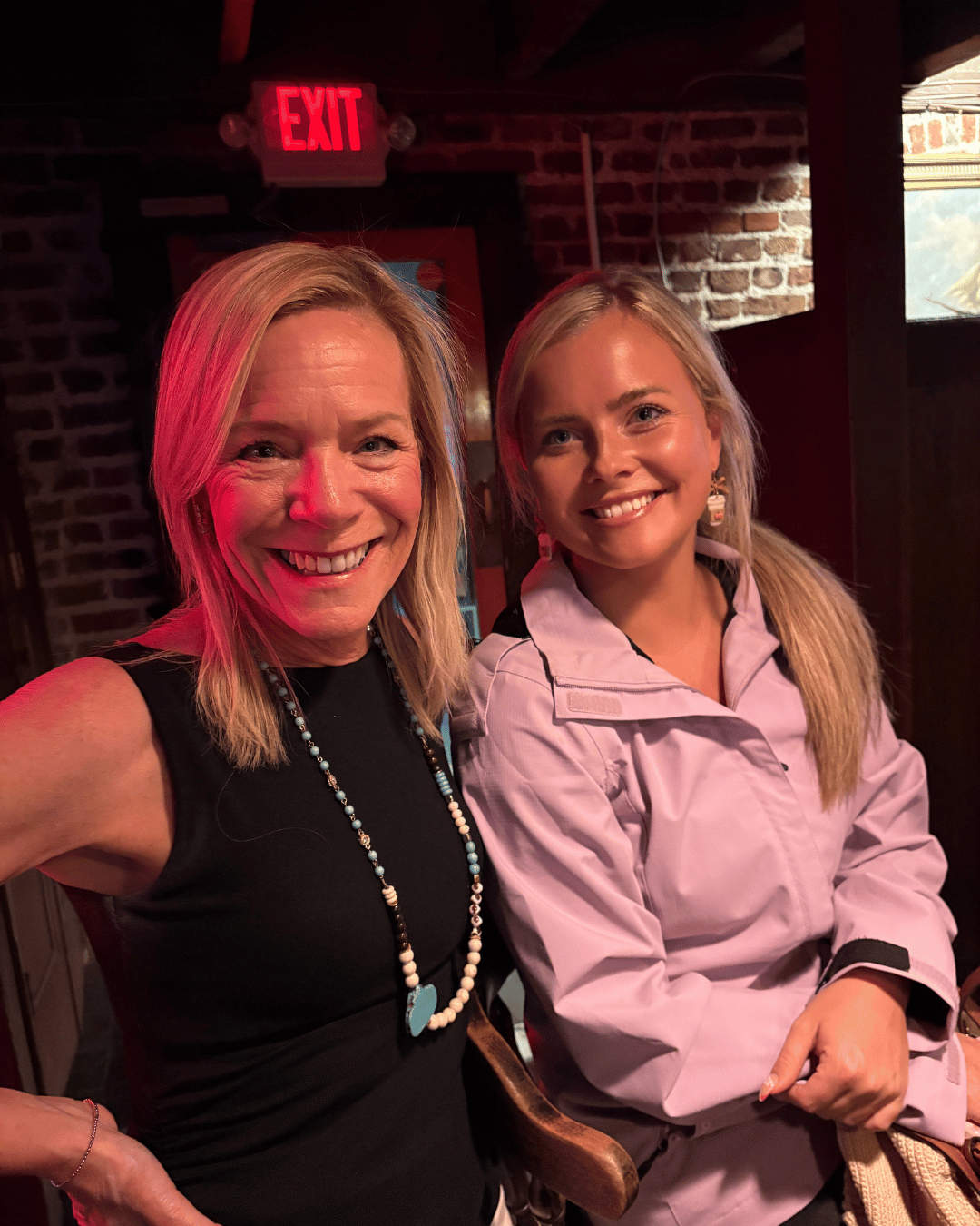 two people waiting for a ghost tour in savannah inside the 1790 Inn and Restaurant